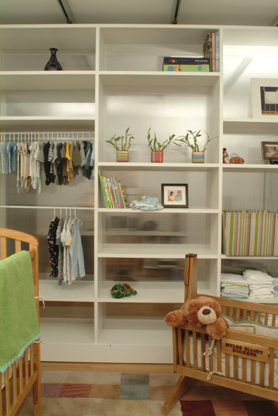 A moveable bookshelf, backed with transluscent Polygal, allows Leah and Kenny to manipulate the size of the second bedroom and neighboring office space, plus it provides storage for baby Myles’ clothing, books and family photos.